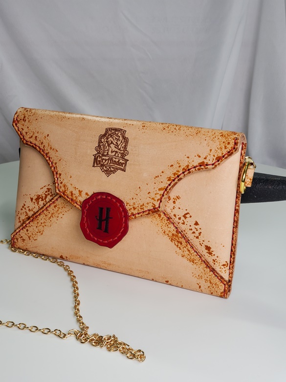 We just got this gently used Louis Vuitton wristlet and crossbody