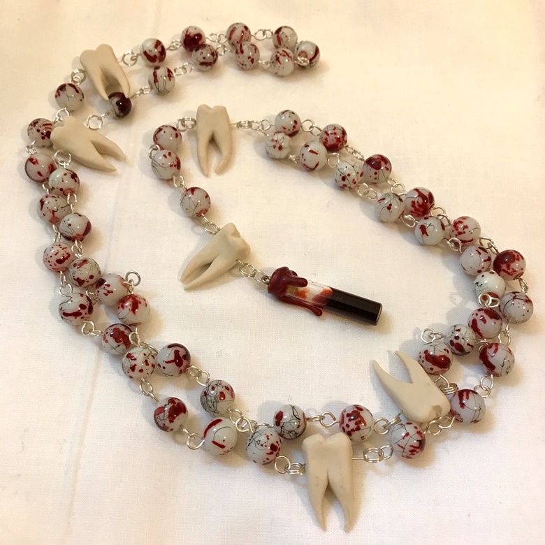 Fake human teeth on sale necklace