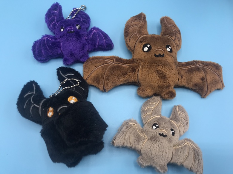 Bat hugging sales stuffed animal