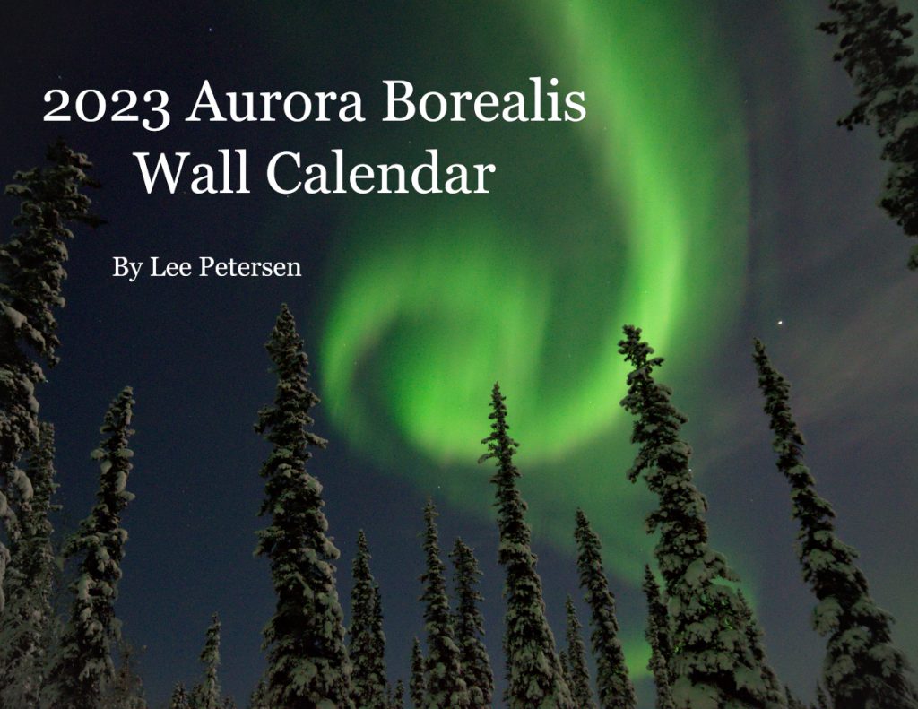 Aurora borealis and a full moon - Lee Petersen