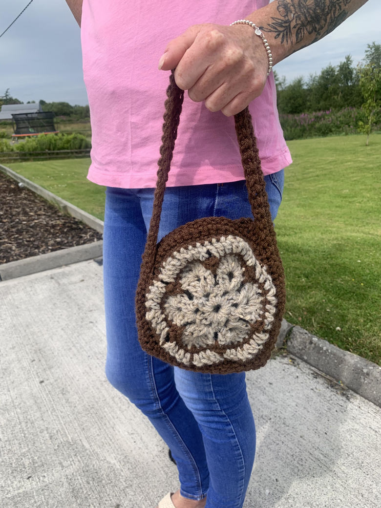 Finished this hexagon bag using scraps from past projects. I lined the  inside with bright yellow felt so the bag doesn't stretch out with use!  Pattern in comments. : r/crochet