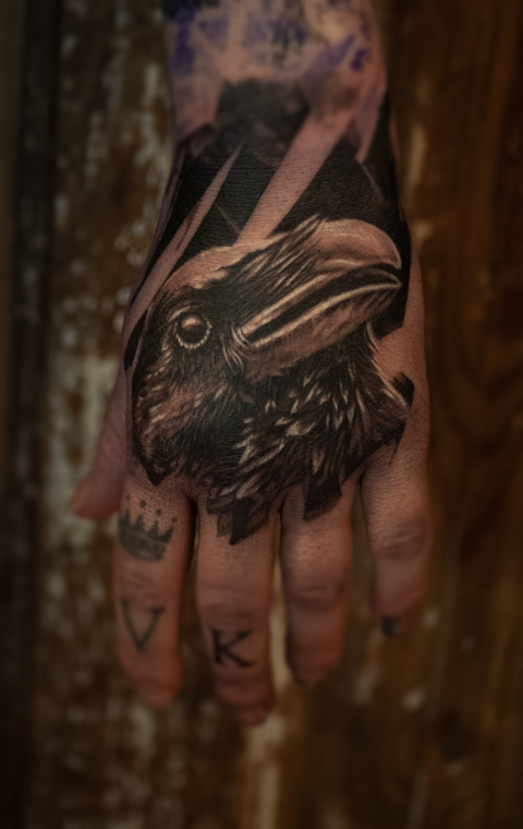 Raven hand-tattoo