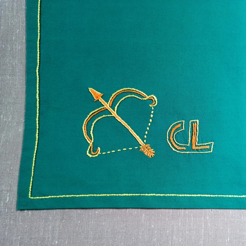Hand-embroidered handkerchief. Sagittarius and mon